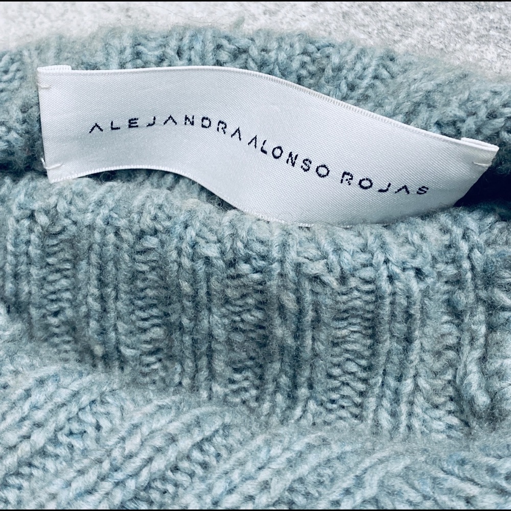 Blue cashmere sweater by Alejandra Alonso Rojas.